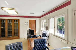 Office area featuring baseboards