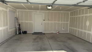 Garage featuring a garage door opener