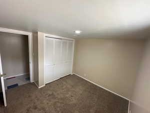 Bedroom 3 showing closet and entry door