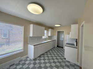 Kitchen with tile backsplash and lots of cabinetry