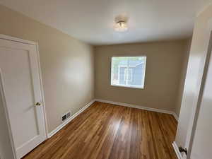 Bedroom  1  Closet on left, Refinished hardwood, and lots of natural light