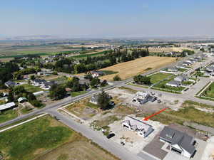 Aerial view of property's location featuring nearby suburban area
