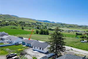 Aerial perspective of suburban area featuring mountains the Wasatch Front