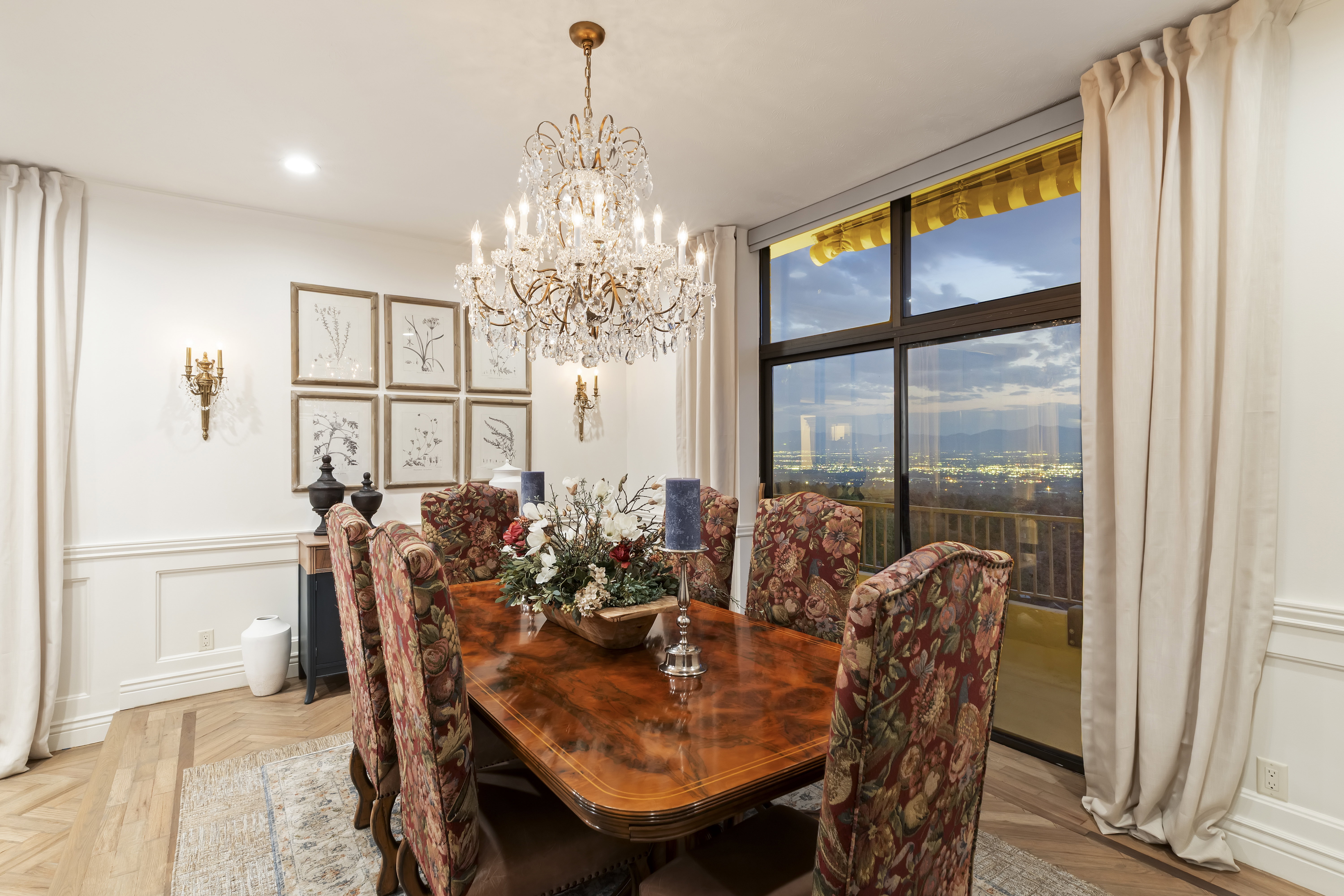 Dining space with a wainscoted wall, a chandelier, a decorative wall, and recessed lighting