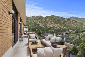 Balcony featuring an outdoor living space and a mountain view