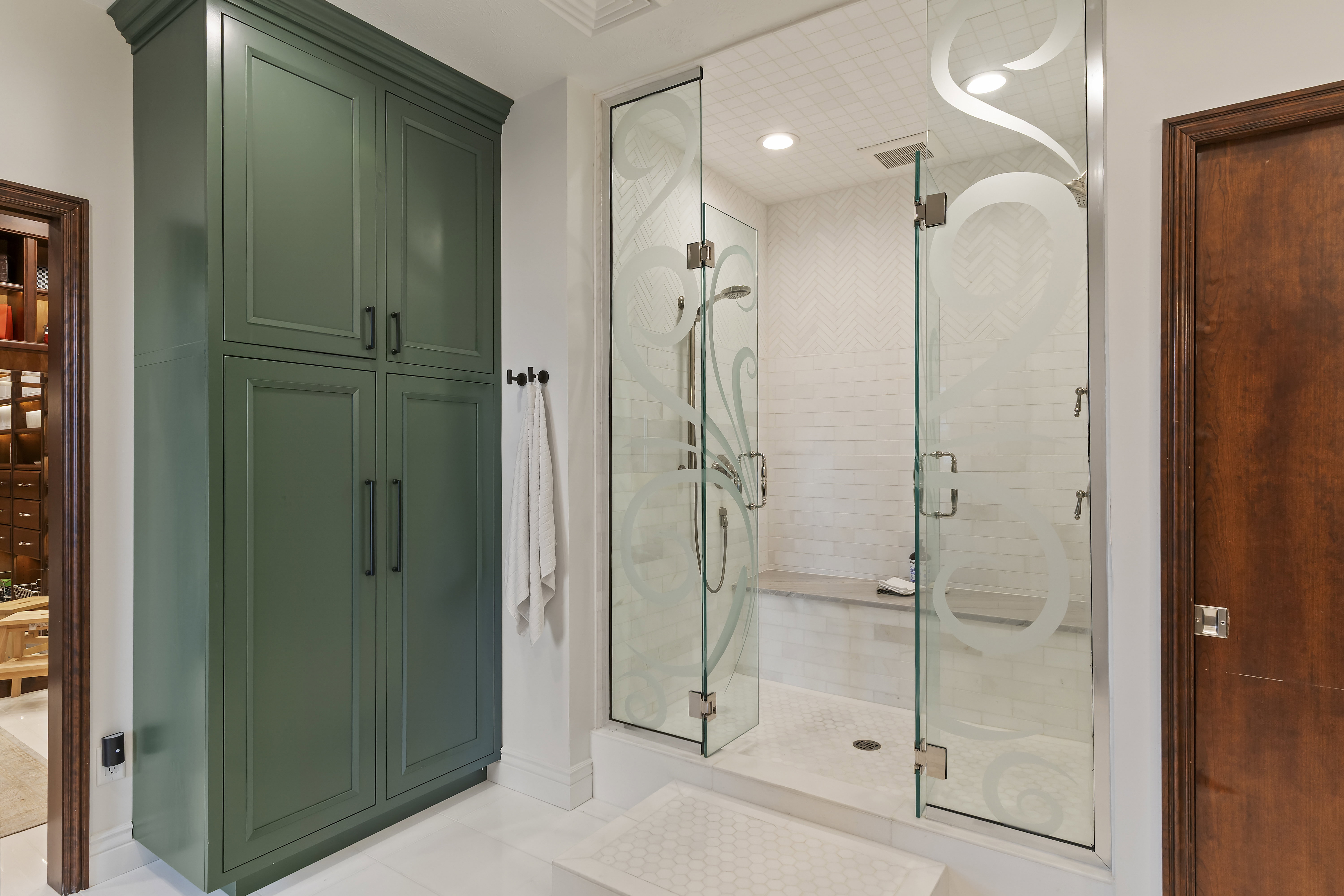 Full bath with a stall shower, tile patterned floors, and a closet