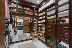 Spacious closet featuring tile patterned flooring