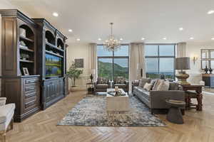 Living area with a chandelier and recessed lighting