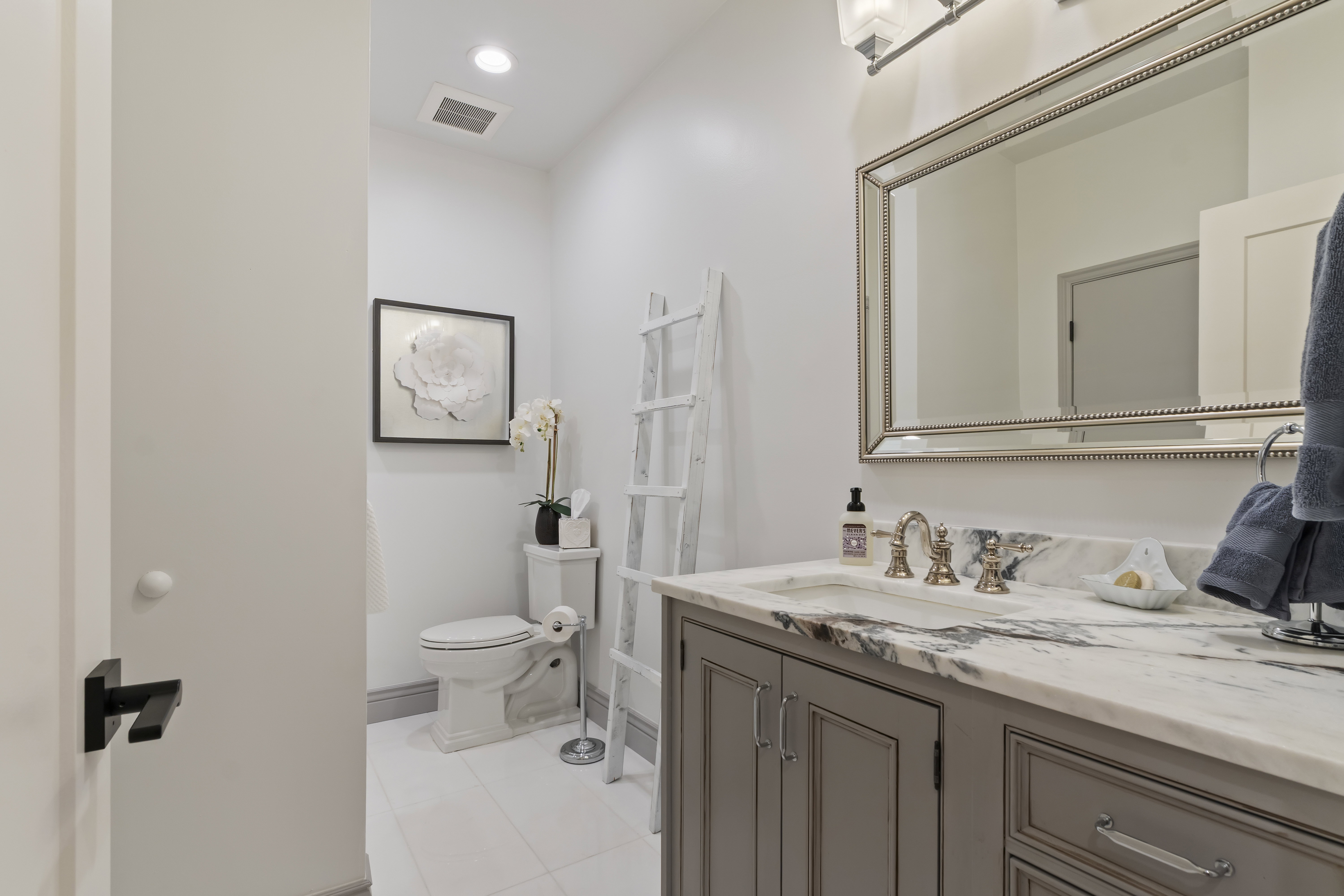 Bathroom featuring vanity, tile patterned flooring, and recessed lighting