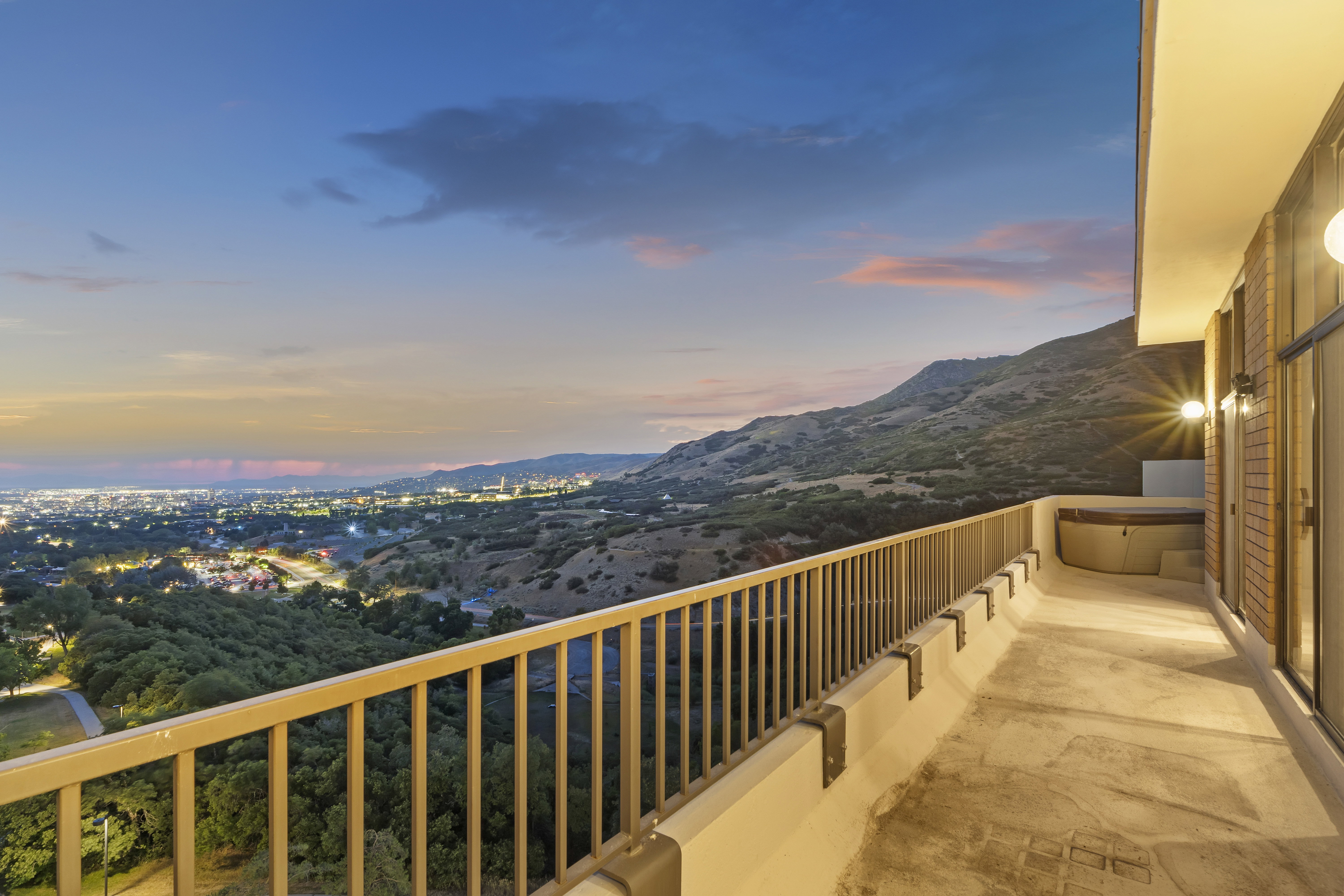 Balcony at dusk with a mountain view
