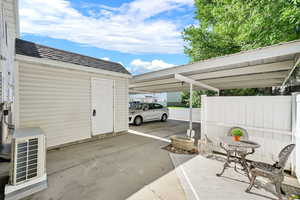 Patio between carport and townhouse
