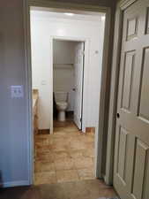 Bathroom with vanity and baseboards