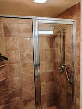 Full bathroom with a stall shower