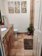 Full bathroom featuring vanity and a shower stall