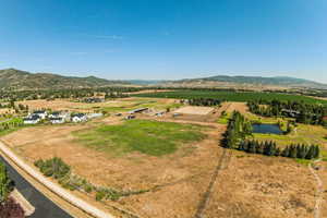 Aerial view of sparsely populated area featuring a water and mountain view