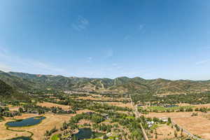 Mountain view featuring a nearby body of water