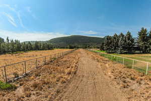 View of road featuring a mountain view and a view of rural / pastoral area