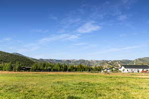 View of mountain background featuring rural landscape