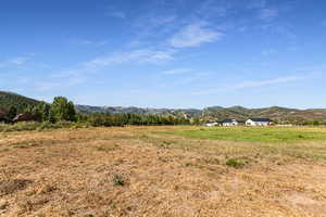 View of mountain background featuring rural landscape