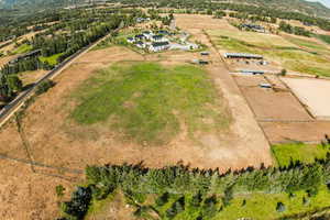 Aerial view of sparsely populated area with a mountainous background