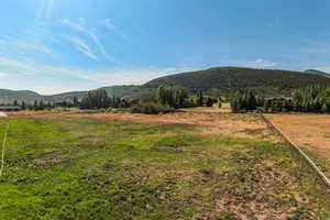 View of mountain background featuring rural landscape