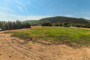 View of mountain background featuring rural landscape