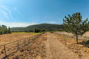 View of street with a mountain view and a view of rural / pastoral area