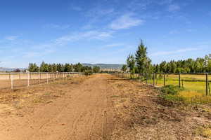 View of yard featuring a view of countryside and a mountain view