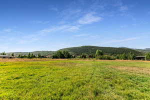 View of mountain background featuring rural landscape