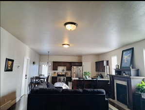 Living area featuring a fireplace and baseboards