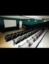 Home theater room featuring beamed ceiling and recessed lighting