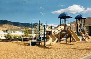 Community jungle gym with a mountain view