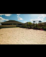 View of community featuring volleyball court