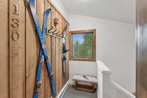 Detailed view of carpet and a baseboard heating unit