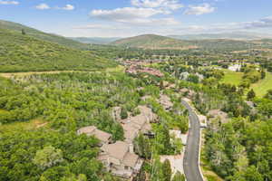 Aerial perspective of suburban area with a water and mountain view