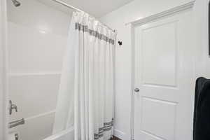 Full bathroom featuring shower / tub combo with curtain