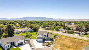 Aerial view of residential area featuring a mountainous background