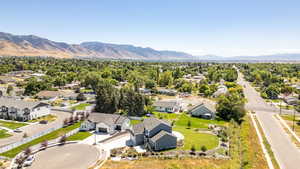 Aerial perspective of suburban area with a mountain backdrop