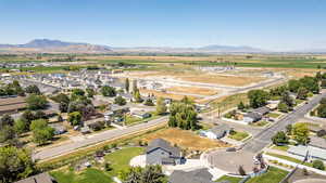 Aerial perspective of suburban area featuring a mountainous background