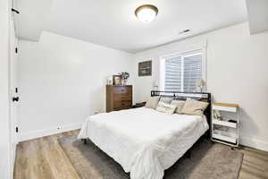 Bedroom with light wood finished floors