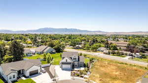 Aerial perspective of suburban area featuring a mountain backdrop