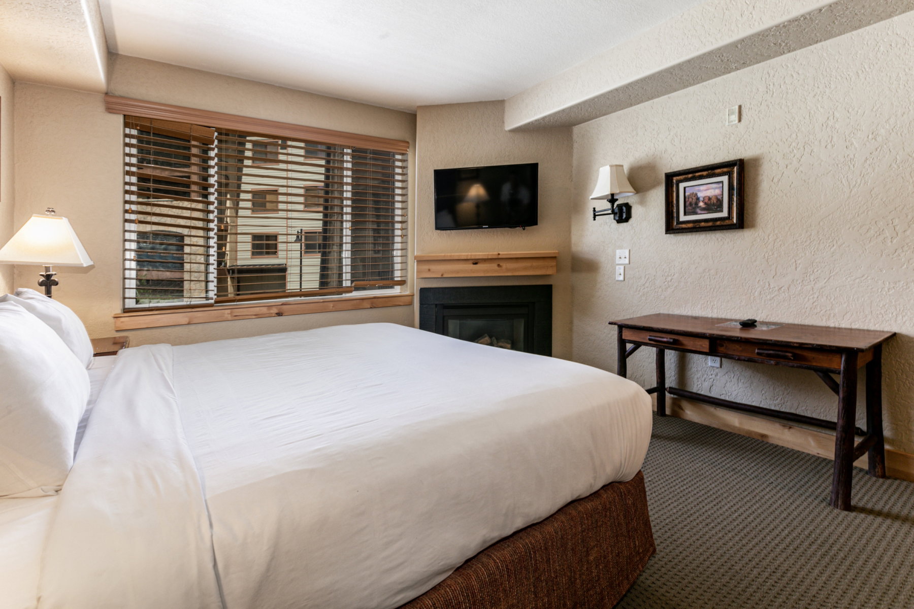Carpeted bedroom featuring a textured wall