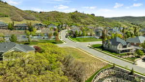 Aerial view of residential area featuring a mountain backdrop