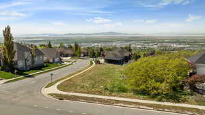 Aerial view of residential area featuring a mountainous background