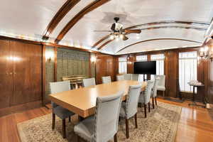 Dining area featuring light wood finished floors, lofted ceiling, and ceiling fan