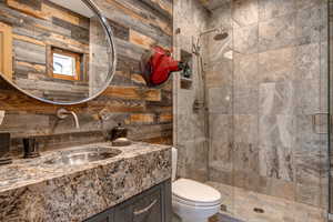 Bathroom featuring a stall shower and vanity