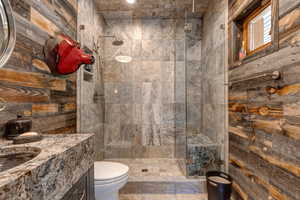 Full bath featuring a shower stall and vanity