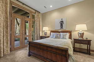 Bedroom featuring carpet flooring, access to exterior, and recessed lighting