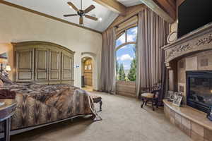 Bedroom featuring a tiled fireplace, high vaulted ceiling, light colored carpet, arched walkways, and beam ceiling