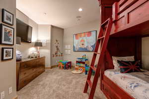 Bedroom featuring light carpet and recessed lighting